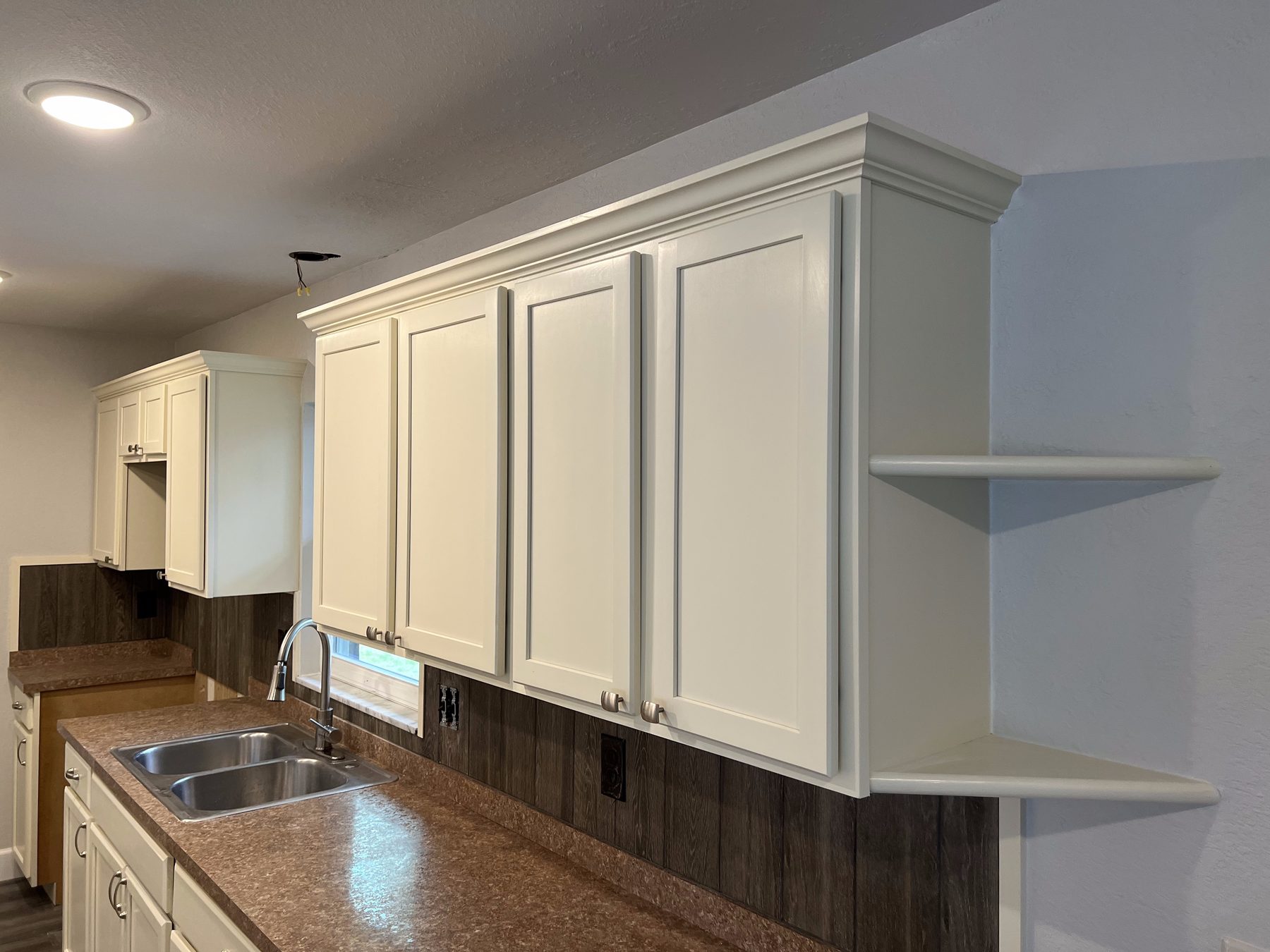 Refinished white kitchen cabinets