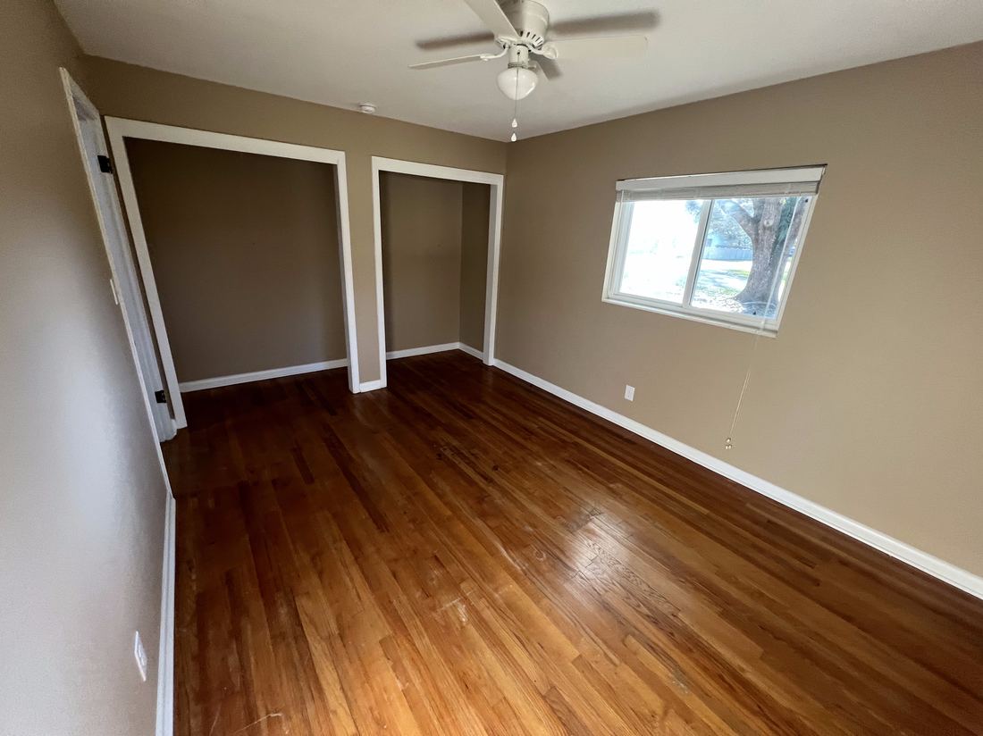 Freshly painted bright room with closets and natural light