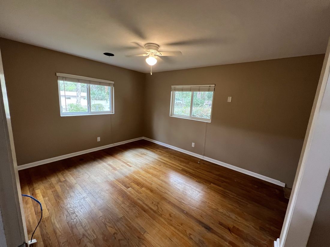 Freshly painted bedroom with hardwood floors